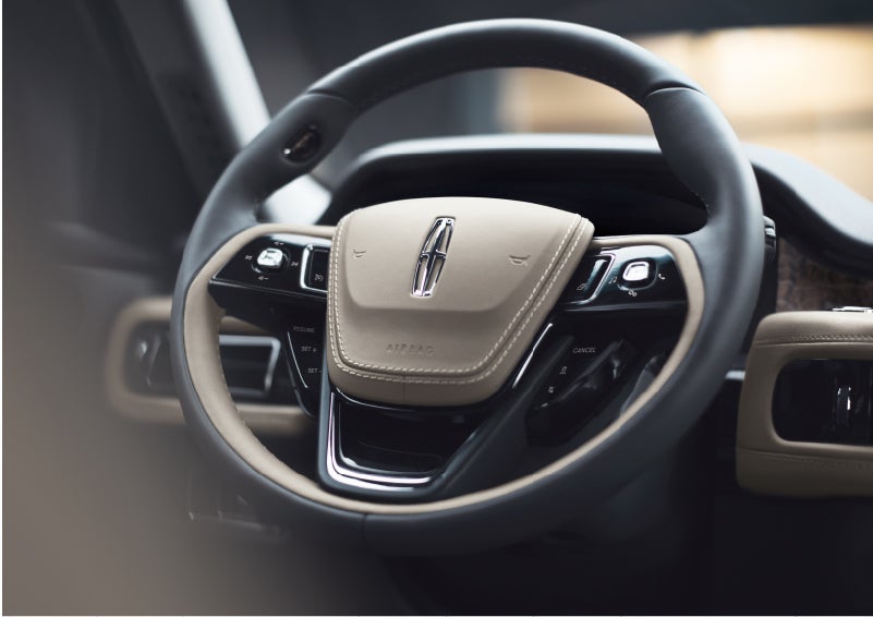 The intuitively placed controls of the steering wheel on a 2023 Lincoln Aviator® SUV | Midland Lincoln in Midland MI