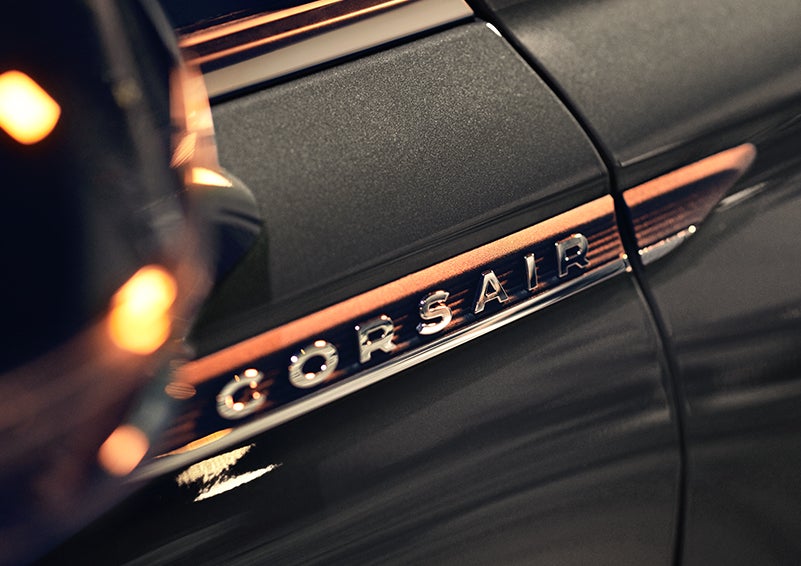 The stylish chrome badge reading “CORSAIR” is shown on the exterior of the vehicle. | Midland Lincoln in Midland MI