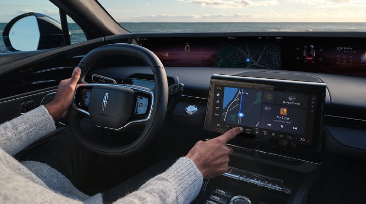 The driver of a 2024 Lincoln Nautilus® SUV interacts with the new Lincoln Digital Experience. | Midland Lincoln in Midland MI