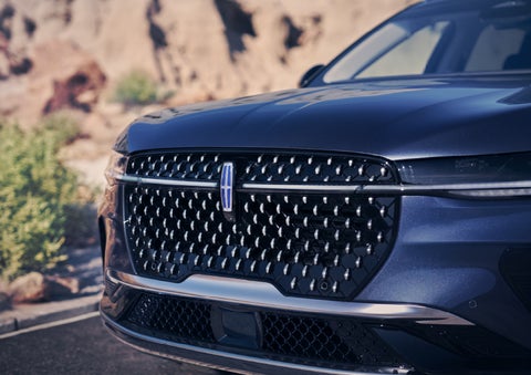 The stylish grille of a 2024 Lincoln Nautilus® SUV sparkles in the sunlight. | Midland Lincoln in Midland MI