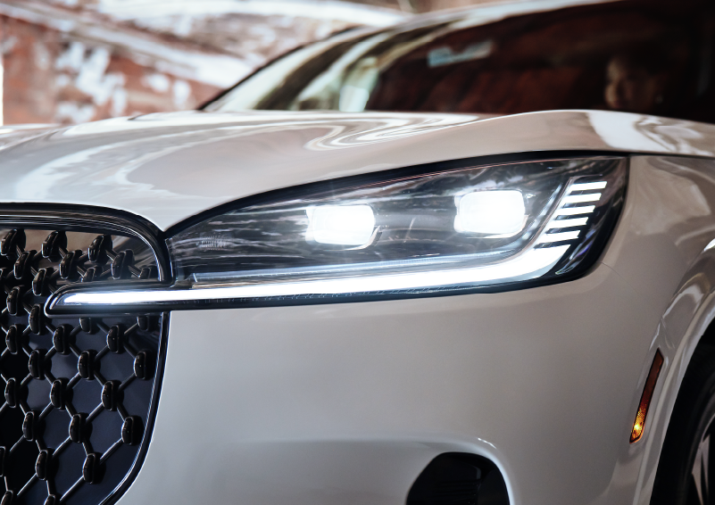 A close-up of a headlamp on the 2025 Lincoln Aviator® SUV is shown. | Midland Lincoln in Midland MI