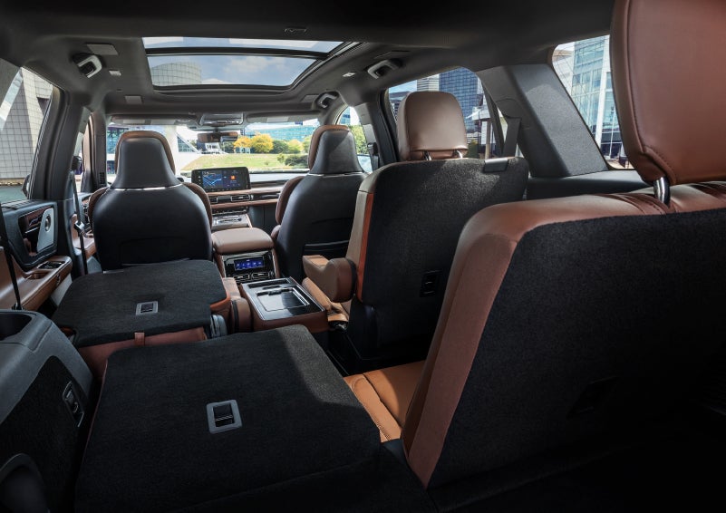 The interior of the 2025 Lincoln Aviator® SUV is shown with two seats folded down for added space. | Midland Lincoln in Midland MI