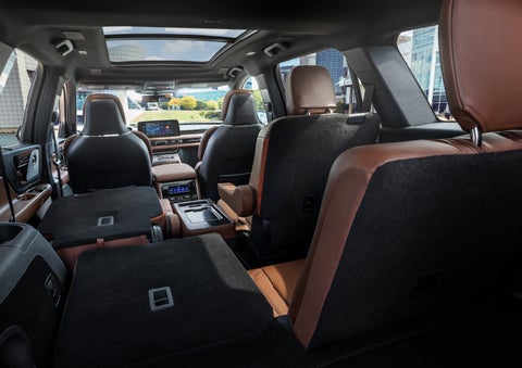 The interior of the 2025 Lincoln Aviator® SUV is shown with two seats folded down for added space. | Midland Lincoln in Midland MI