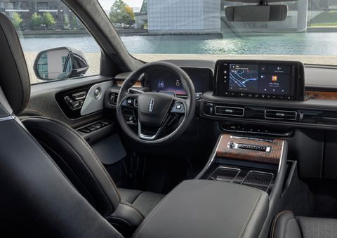 The interior of the 2025 Lincoln Aviator® SUV is shown parked with a view of a harbor through the windshield. | Midland Lincoln in Midland MI