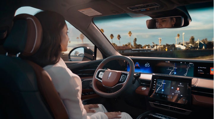 A person is shown driving hands-free on the highway with available Lincoln BlueCruise technology. | Midland Lincoln in Midland MI