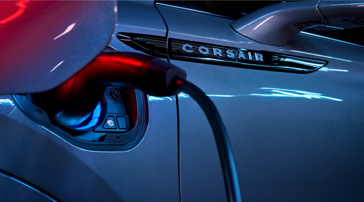 A charger plugged into the charging port of a 2025 Lincoln Corsair® Plug-in Hybrid model. | Midland Lincoln in Midland MI