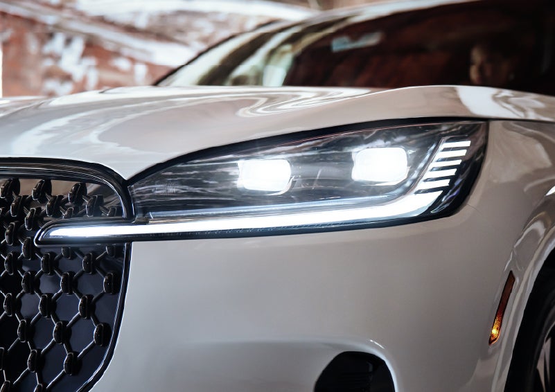 A close-up of a headlamp on the 2026 Lincoln Aviator® SUV is shown. | Midland Lincoln in Midland MI