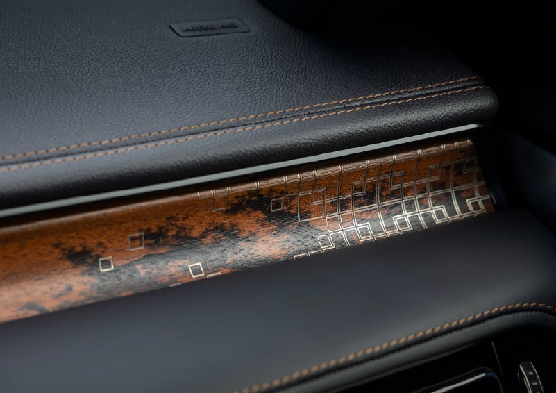 A close-up shot of the 2026 Lincoln Aviator® dashboard with unique black and brown accents and brown stitching. | Midland Lincoln in Midland MI